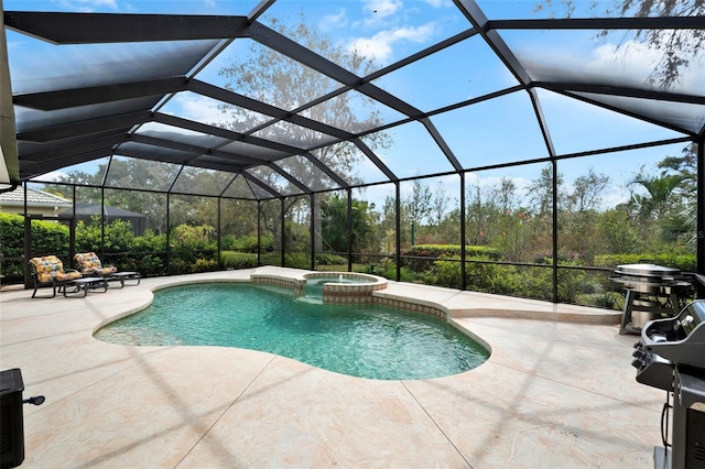 view of swimming pool with a patio, glass enclosure, and a pool with connected hot tub