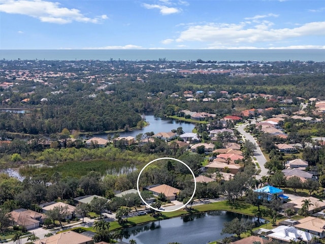 birds eye view of property featuring a water view