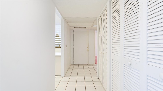 hallway with light tile patterned floors