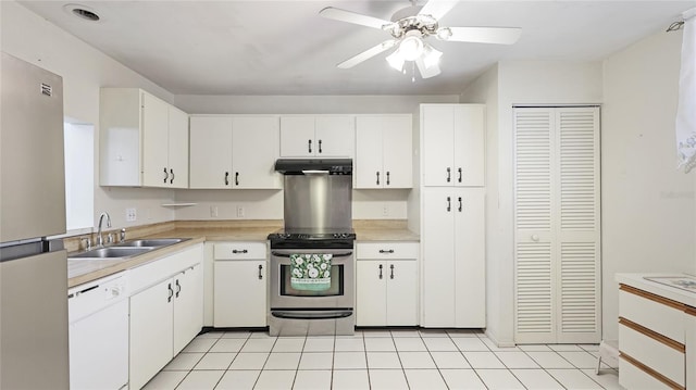 kitchen featuring stainless steel appliances, light countertops, under cabinet range hood, white cabinetry, and a sink