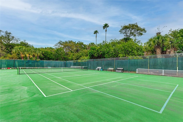 view of tennis court with fence