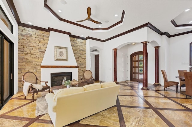 living room with baseboards, recessed lighting, a glass covered fireplace, marble finish floor, and ornate columns