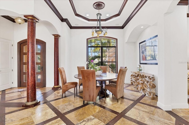 dining area with baseboards, ornamental molding, decorative columns, recessed lighting, and a raised ceiling