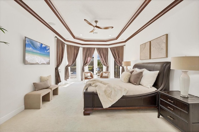 carpeted bedroom with crown molding, baseboards, a raised ceiling, a ceiling fan, and access to outside