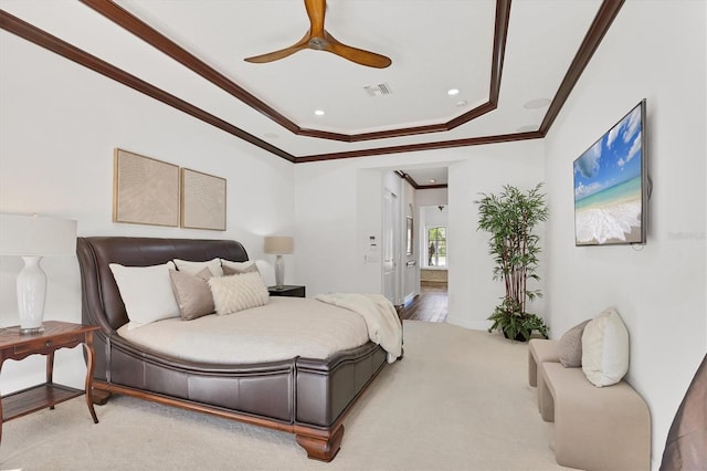 carpeted bedroom with visible vents, recessed lighting, ceiling fan, crown molding, and a raised ceiling