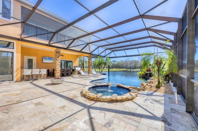 view of pool featuring outdoor dry bar, a patio area, a pool with connected hot tub, and glass enclosure