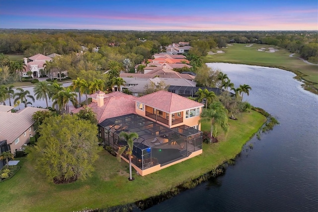 birds eye view of property with a residential view and a water view