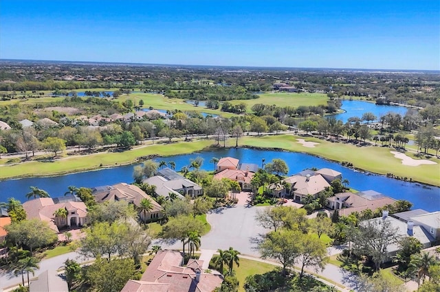 birds eye view of property featuring a residential view, a water view, and view of golf course