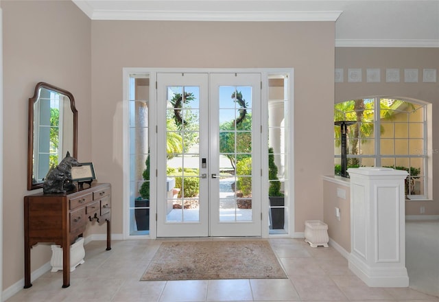 doorway to outside featuring tile patterned floors, french doors, plenty of natural light, and ornamental molding