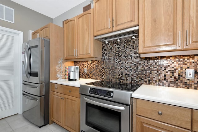 kitchen featuring under cabinet range hood, backsplash, visible vents, and appliances with stainless steel finishes