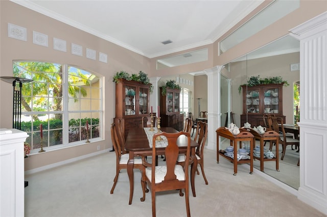 dining area with decorative columns, light carpet, visible vents, and ornamental molding