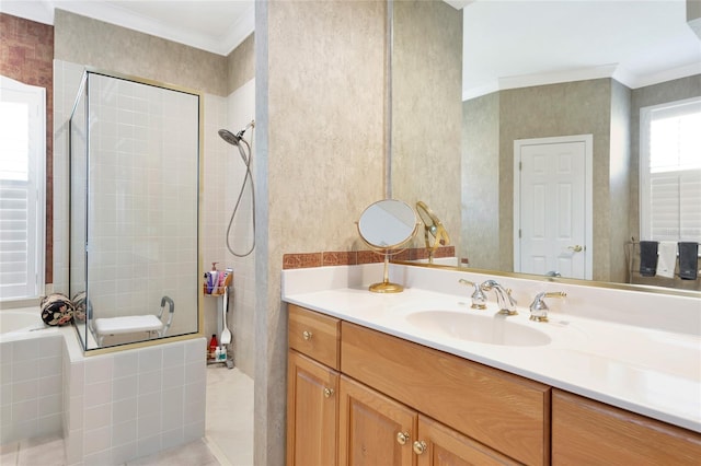 bathroom featuring vanity, crown molding, tiled tub, and a tile shower