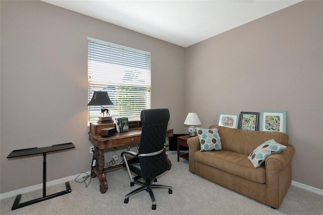 carpeted office space featuring baseboards