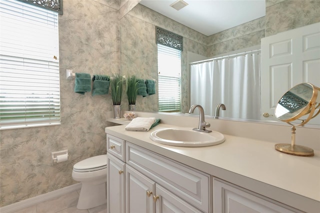 bathroom with vanity, visible vents, wallpapered walls, tile patterned flooring, and toilet