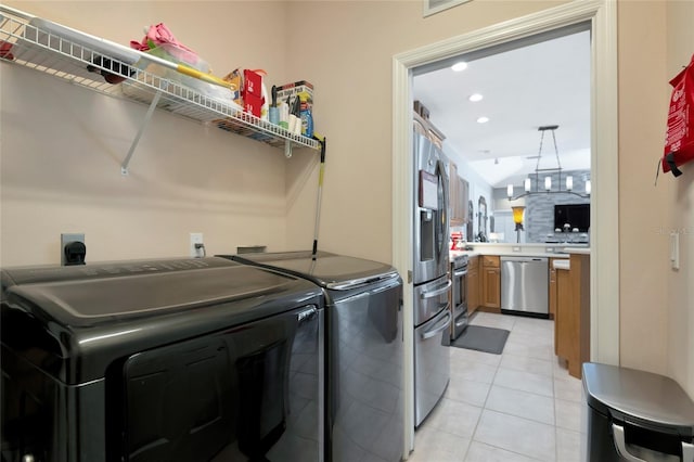 laundry room featuring light tile patterned floors, laundry area, independent washer and dryer, and recessed lighting