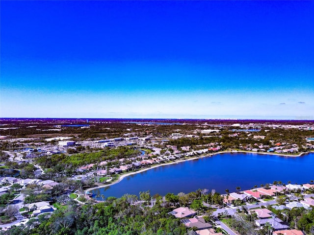 bird's eye view featuring a residential view and a water view