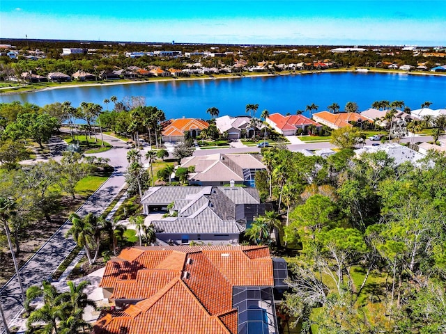 birds eye view of property with a residential view and a water view