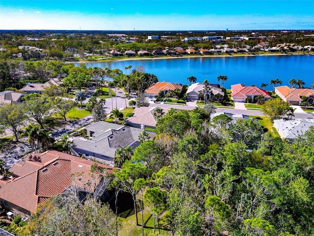 birds eye view of property featuring a residential view and a water view