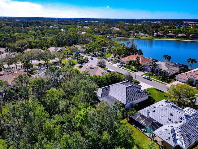 birds eye view of property with a residential view and a water view