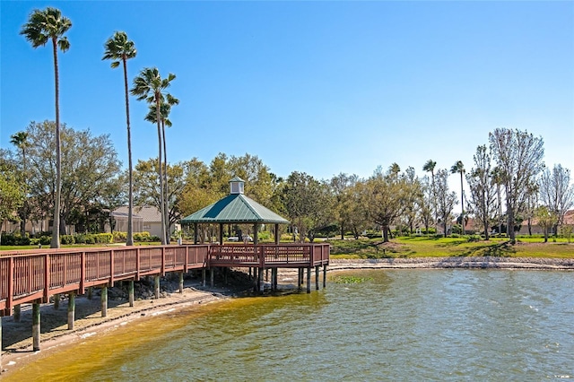 view of dock with a gazebo and a water view