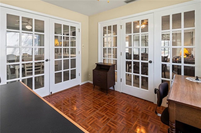 doorway with visible vents and french doors