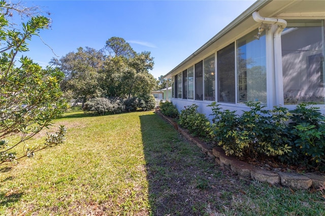 view of yard with a sunroom