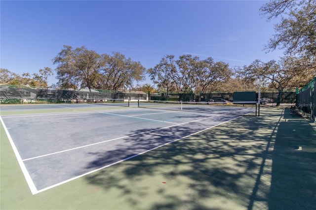 view of sport court with fence