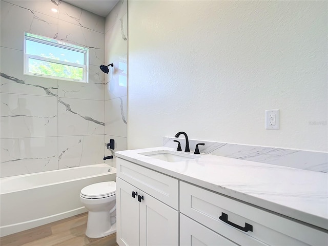 full bath featuring toilet, vanity, wood finished floors, and shower / bathtub combination