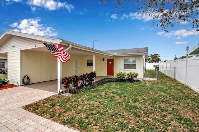 single story home with a front yard, a gate, and fence