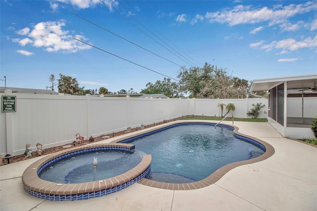 view of swimming pool with a pool with connected hot tub, a fenced backyard, and a sunroom