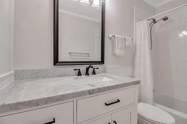 full bathroom featuring vanity, toilet, crown molding, and shower / tub combo