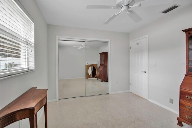 bedroom featuring speckled floor, baseboards, visible vents, and a closet