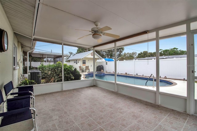 unfurnished sunroom with a ceiling fan