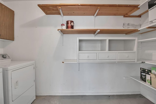 clothes washing area with washing machine and clothes dryer