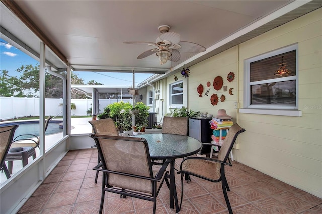 sunroom / solarium with ceiling fan