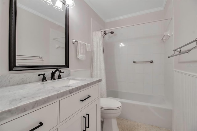 bathroom featuring wainscoting, toilet, speckled floor, and ornamental molding