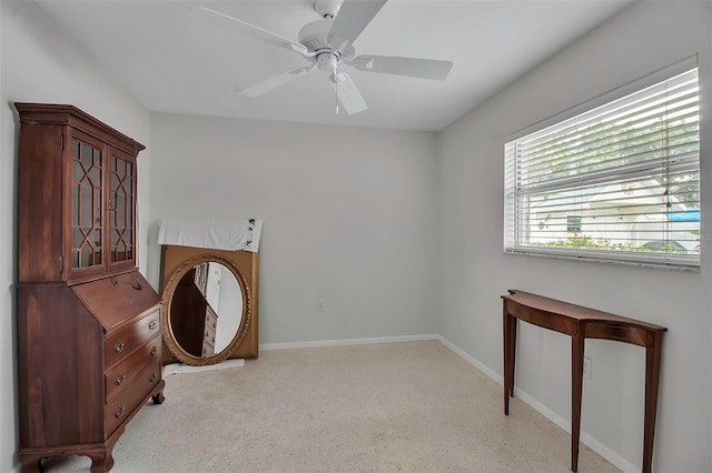 interior space featuring a ceiling fan and baseboards