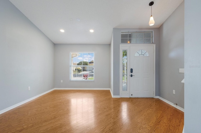 entrance foyer featuring recessed lighting, baseboards, and wood finished floors