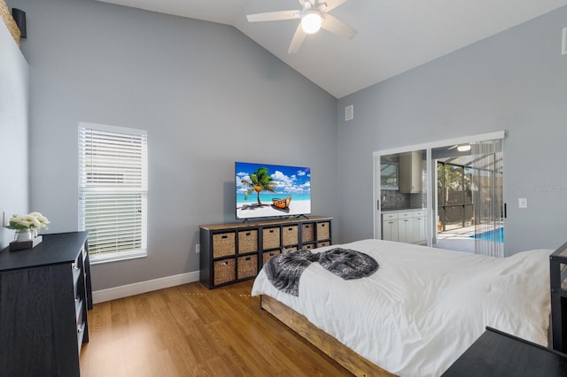 bedroom featuring access to outside, a ceiling fan, high vaulted ceiling, light wood-type flooring, and baseboards