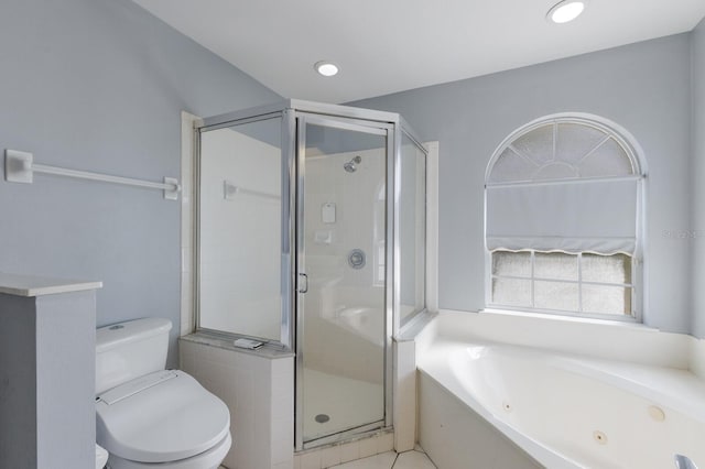 bathroom with a tub with jets, a shower stall, toilet, and recessed lighting