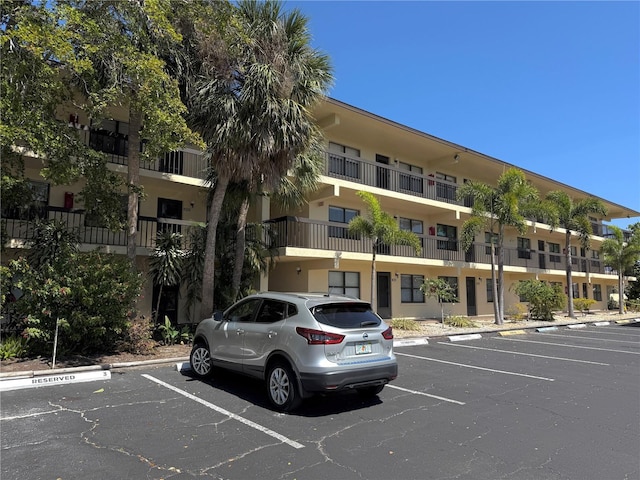 view of property with uncovered parking