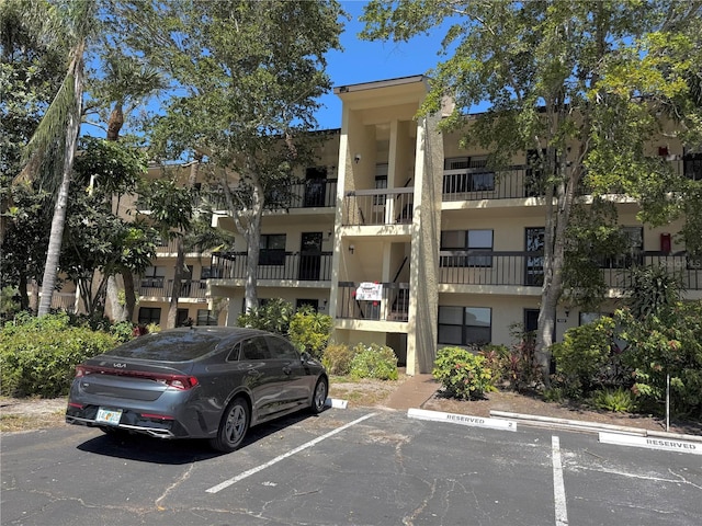 view of property with uncovered parking