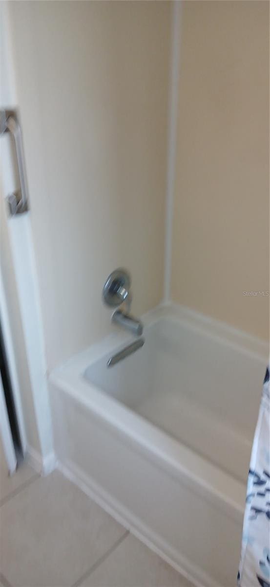 3013 Yarmouth Dr W, Bradenton, FL 34205 - full bath with shower / bathtub combination with curtain and tile patterned flooring