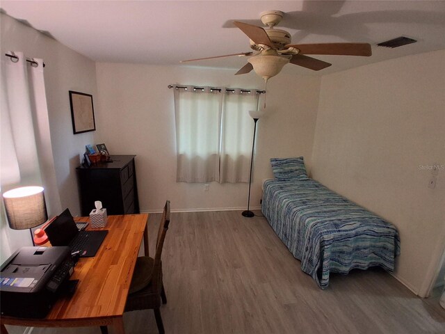 3013 Yarmouth Dr W, Bradenton, FL 34205 - bedroom featuring wood finished floors, a desk, and ceiling fan