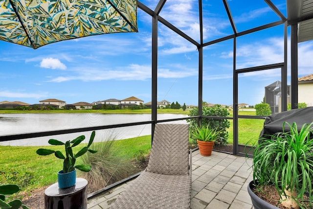 sunroom with a water view