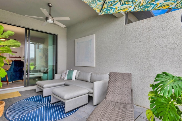 view of patio featuring an outdoor living space and a ceiling fan