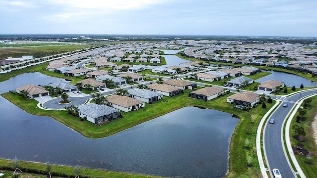 aerial view featuring a water view and a residential view