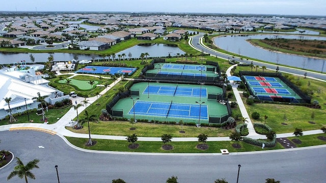 bird's eye view with a water view and a residential view