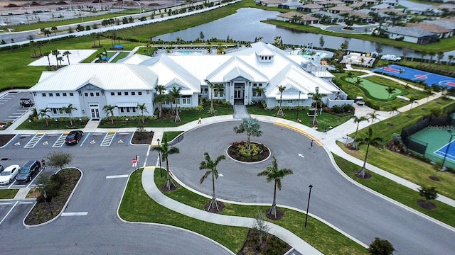 drone / aerial view with a residential view and a water view