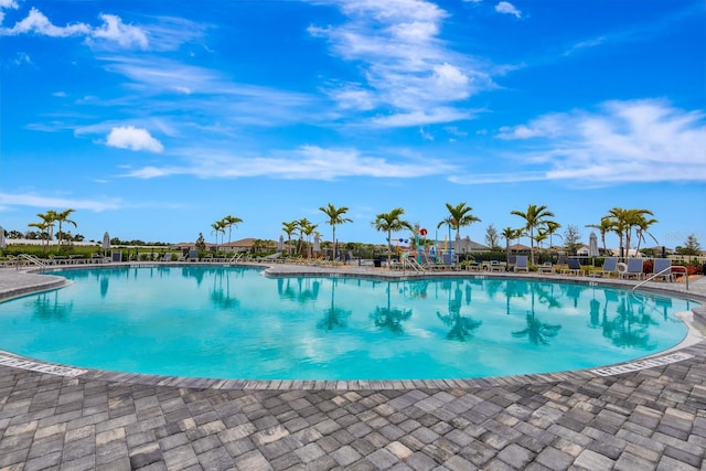 community pool with a patio area